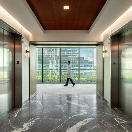 Healthcare Facility Hallway with Marble Flooring and Elevators Modern healthcare facility hallway with marble flooring and elevators