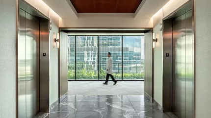 Healthcare Facility Hallway with Marble Flooring and Elevators Modern healthcare facility hallway with marble flooring and elevators