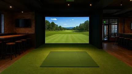 Modern golf simulator setup with green flooring Indoor golf simulator room with green flooring