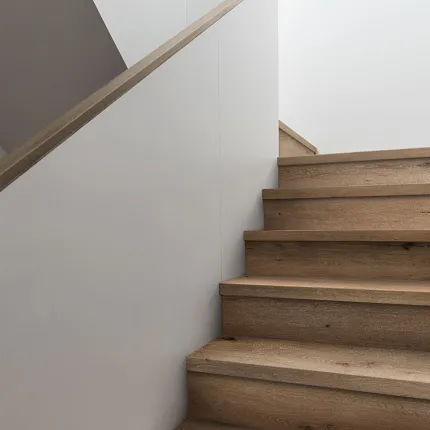 Wood Look Luxury Vinyl Plank Flooring on Staircase - Durable and Stylish Modern staircase with wood look luxury vinyl plank flooring