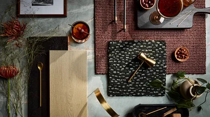 Premium Hardwood and Carpet Flooring Samples Display Elegant display of hardwood and carpet samples in natural and burgundy tones with decorative items and tableware