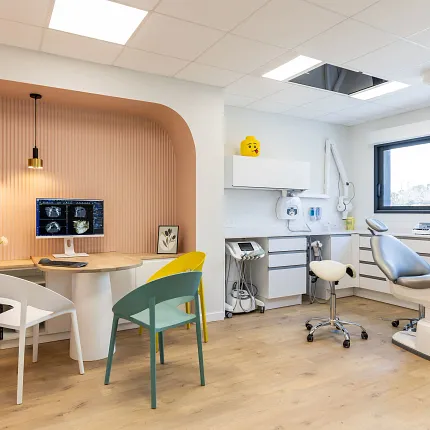 Modern dental office with light wood flooring