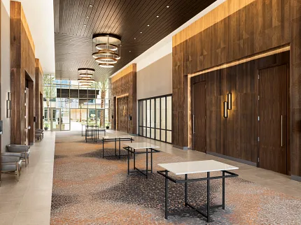 Modern Hospitality Facility with Commercial Carpet Tile Flooring Spacious hospitality facility with modern design featuring commercial carpet tile in a blend of brown and beige tones