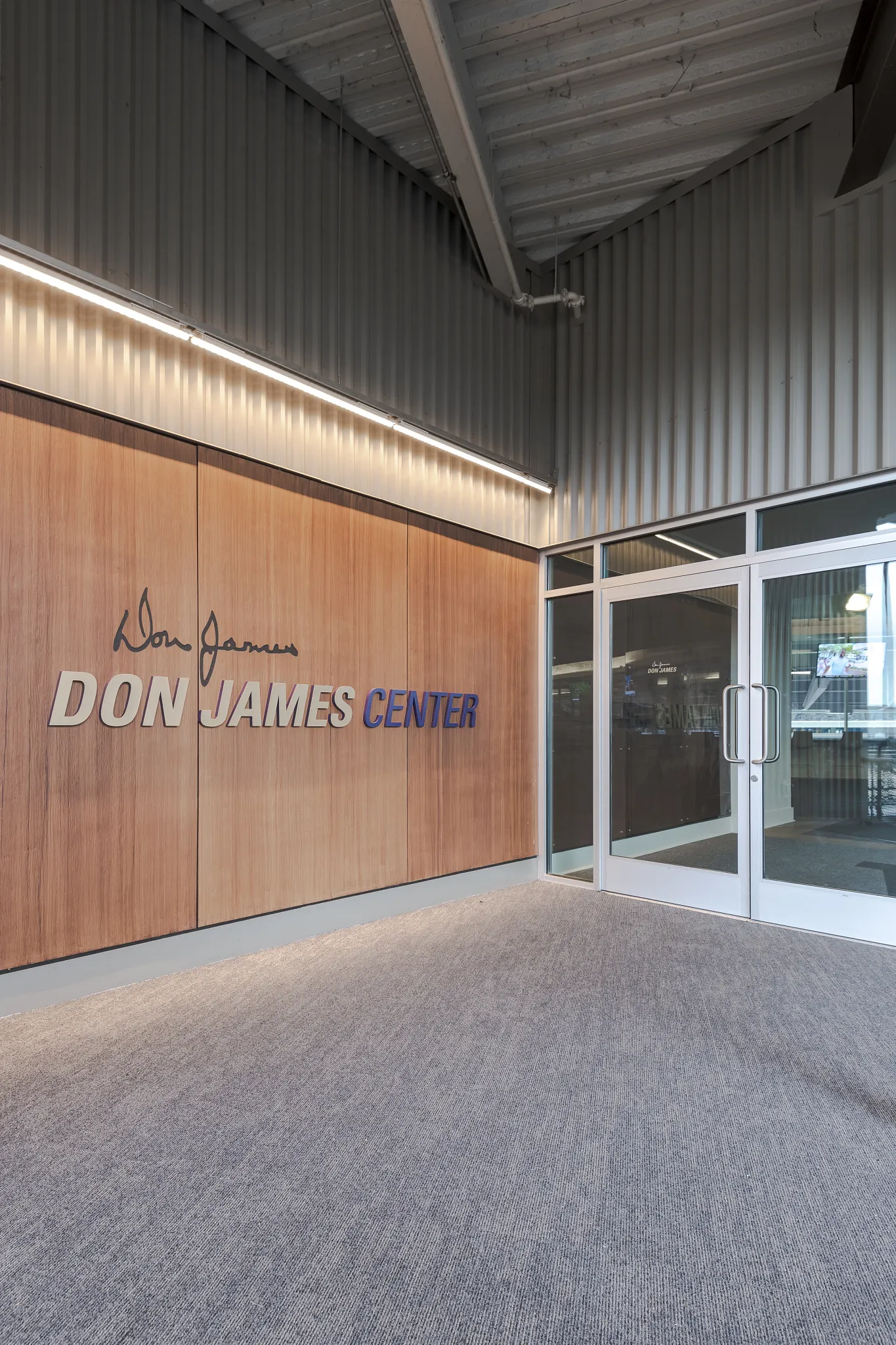 Entrance of Don James Center with commercial carpet flooring in an education facility