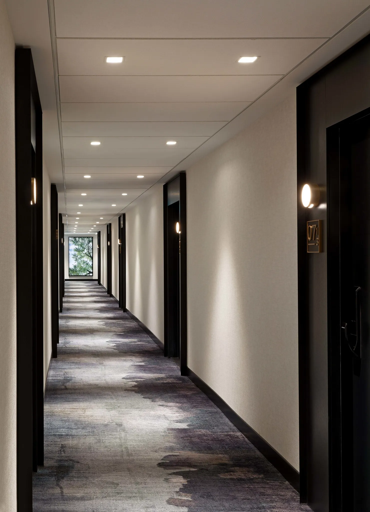 Modern hotel corridor with abstract patterned commercial carpet tile flooring