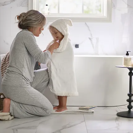 Elegant White Marble Tile Flooring for a Cozy and Comfortable Home Cozy bathroom scene with elegant white marble tile flooring, showcasing a serene and comfortable home environment