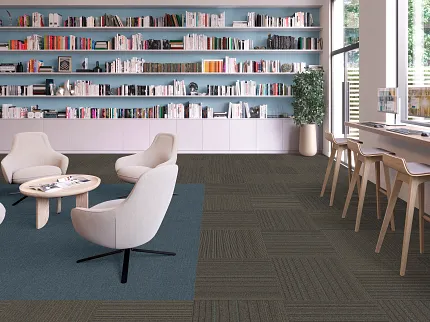 Education Facility with Commercial Carpet Tile Flooring in Blue and Brown Modern education facility with comfortable seating and commercial carpet tile flooring in blue and brown tones