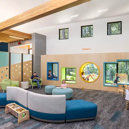 Children's Education Facility with Commercial Carpet Tile Flooring Modern children's education facility with colorful seating and play areas, featuring commercial carpet tile flooring in a vibrant, playful design.