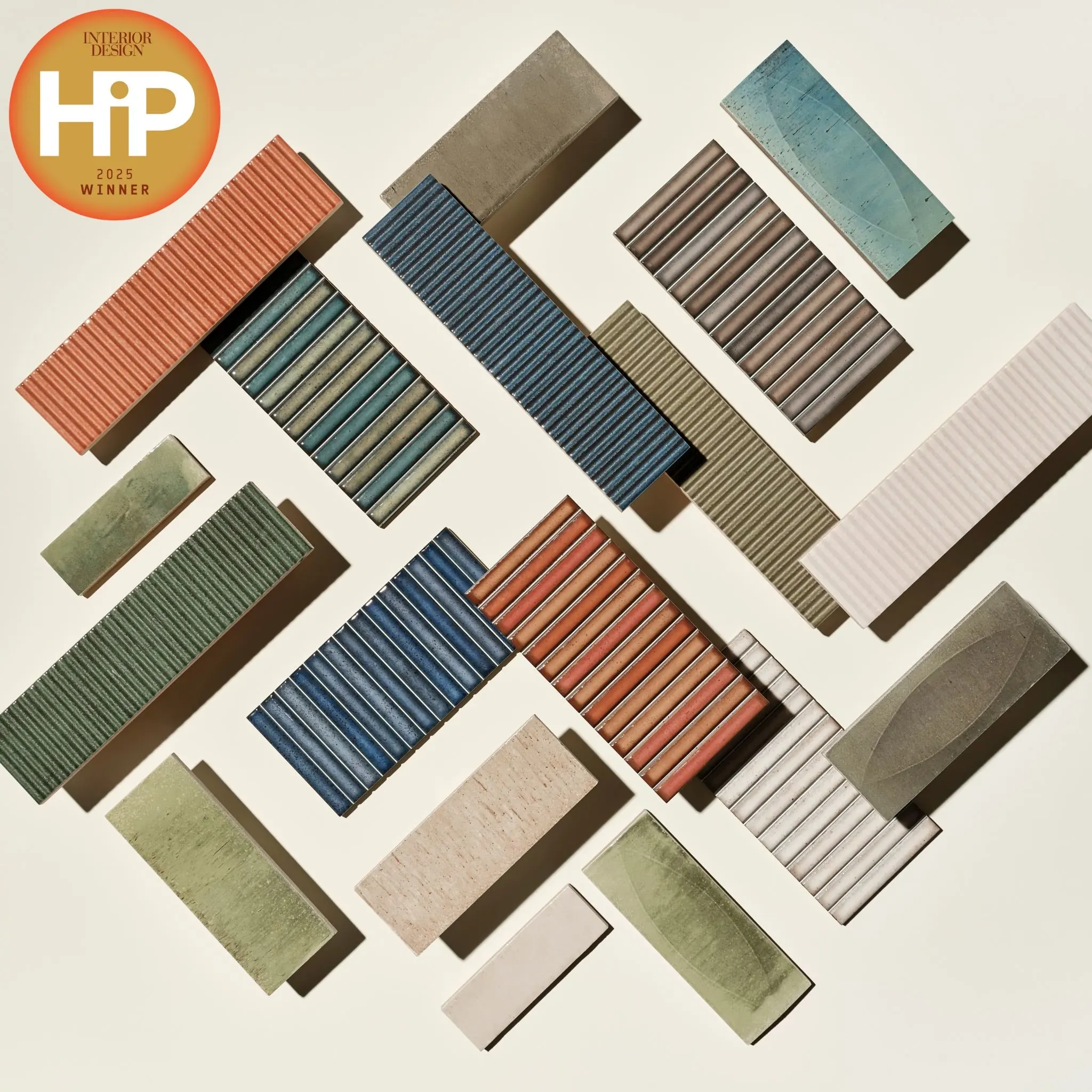 Assorted tile samples in various colors including red, blue, green, and beige