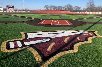 Artificial Turf Baseball Field with Logo Artificial turf baseball field with logo and scoreboard in background