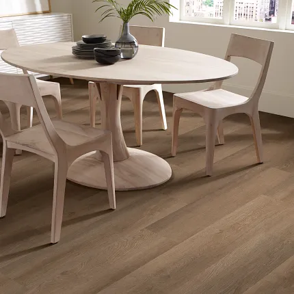 Elegant Hardwood Flooring in a Contemporary Dining Room Setting Modern dining room with light wood furniture and durable hardwood flooring