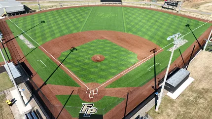 Baseball field with artificial turf and brown infield Aerial view of a baseball field with artificial turf and brown infield