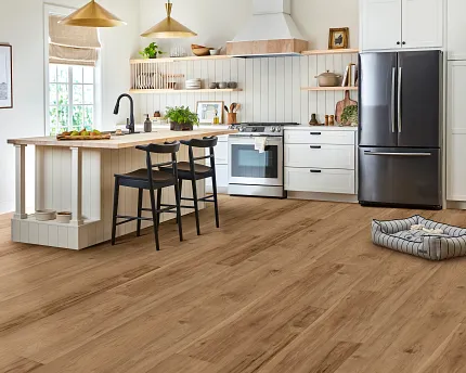 Elegant hardwood flooring in a bright and cozy home setting Spacious living and dining area with natural light and warm-toned hardwood flooring