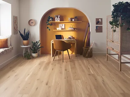 Wood Look Luxury Vinyl Plank Flooring in Modern Home Office Scene Modern home office with wood look luxury vinyl plank flooring, featuring a cozy workspace with a chair, desk, and plants