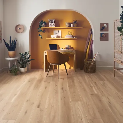 Wood Look Luxury Vinyl Plank Flooring in Modern Home Office Scene Modern home office with wood look luxury vinyl plank flooring, featuring a cozy workspace with a chair, desk, and plants