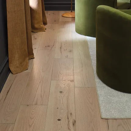 Light Oak Engineered Hardwood Flooring in a Cozy Living Room Setting Cozy living room with light oak engineered hardwood flooring, featuring green velvet chairs and beige curtains