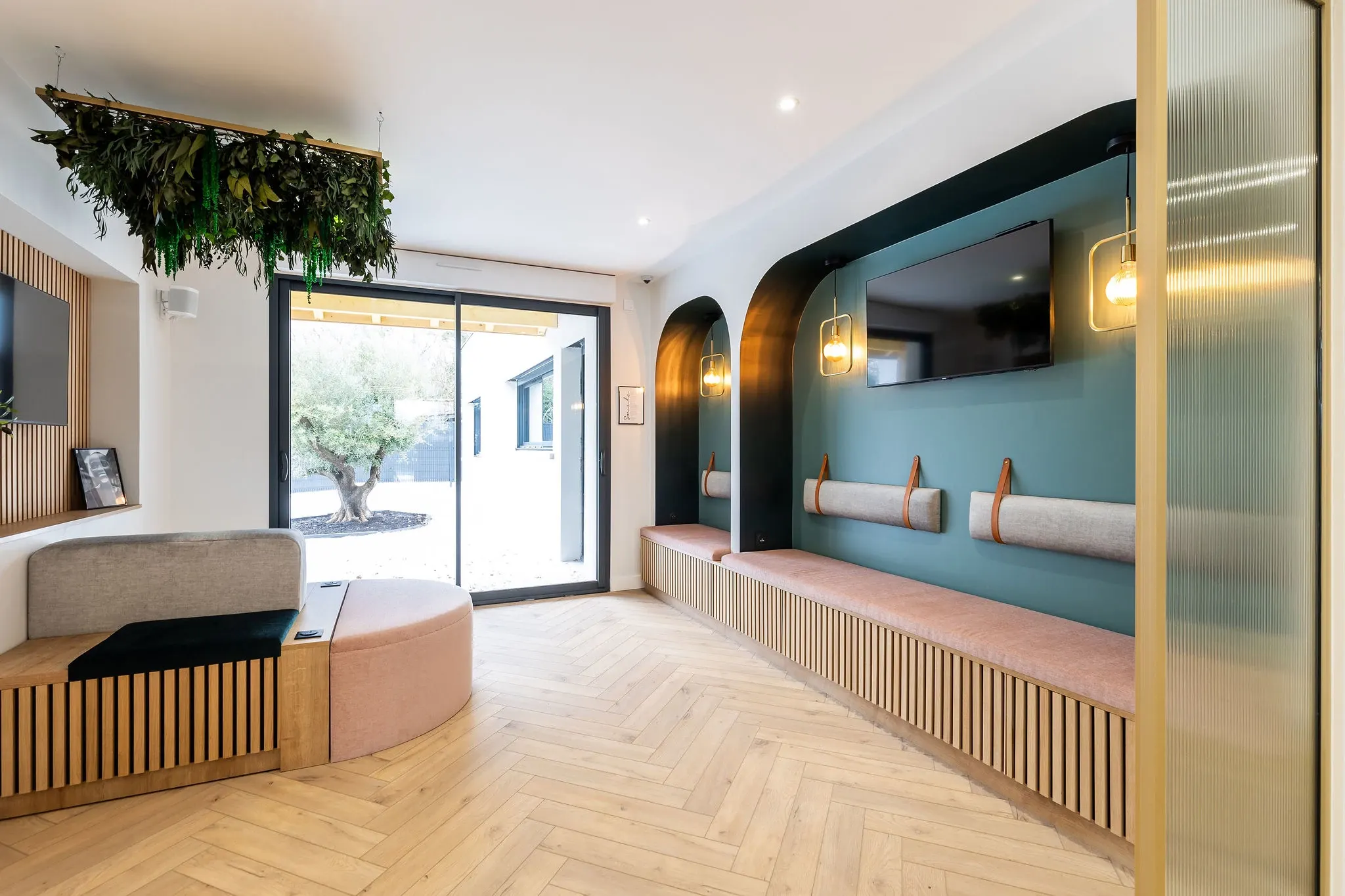Modern room with herringbone wood flooring and stylish seating