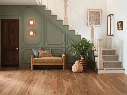 Premium Hardwood Flooring for Traditional Home Interiors Elegant hardwood flooring in a spacious hallway with natural wood tones