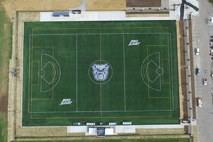 Artificial Turf Sports Field with Bulldog Logo and Big East Branding Aerial view of a sports field with artificial turf featuring a bulldog logo and Big East branding