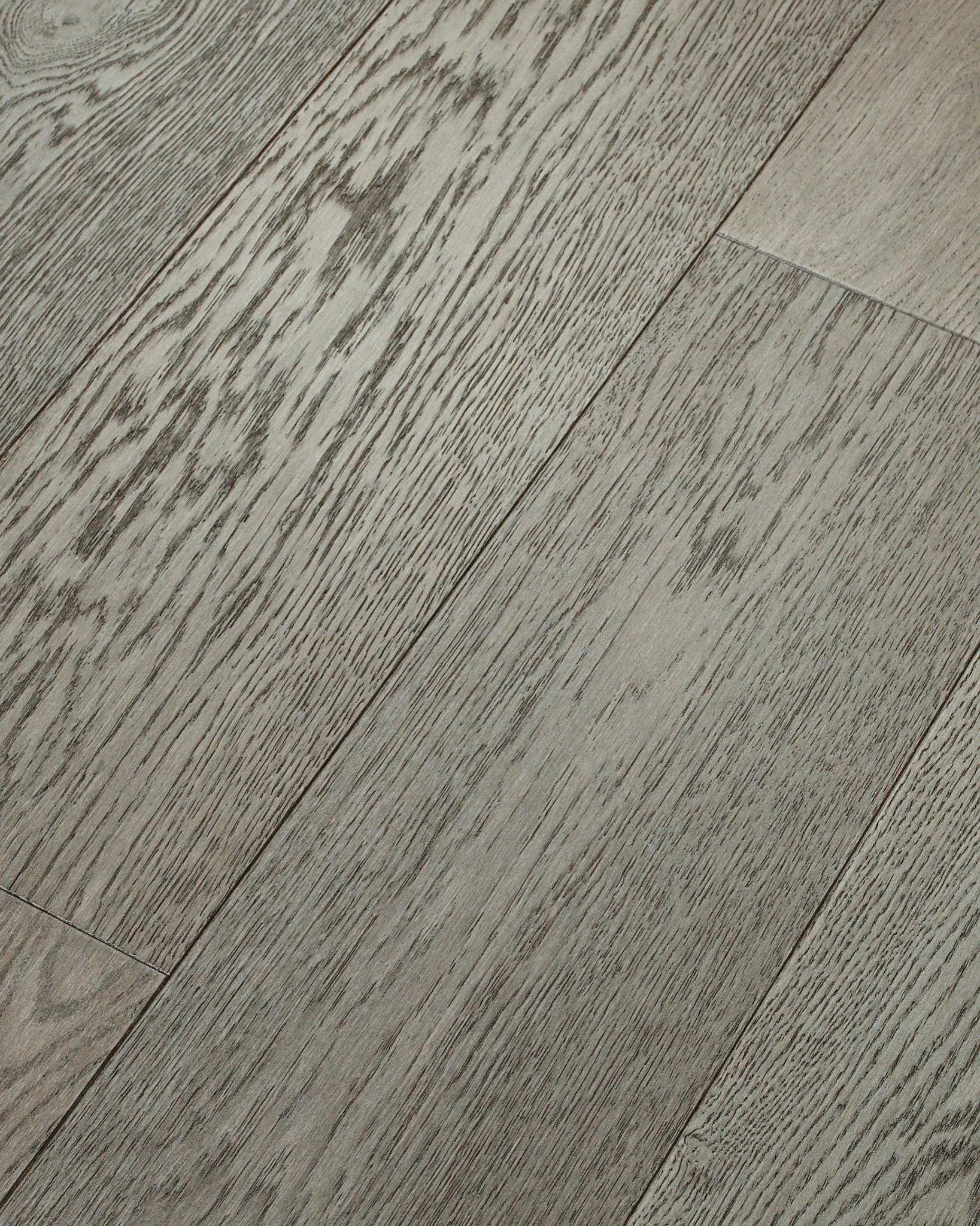 Grey hardwood flooring with visible wood grain texture