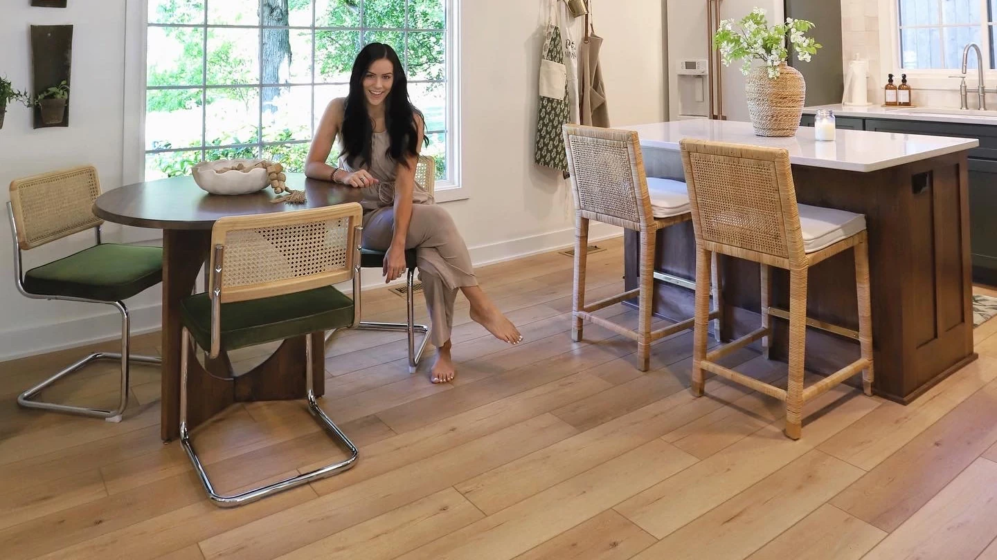 Modern kitchen with wood look luxury vinyl plank flooring and stylish furniture