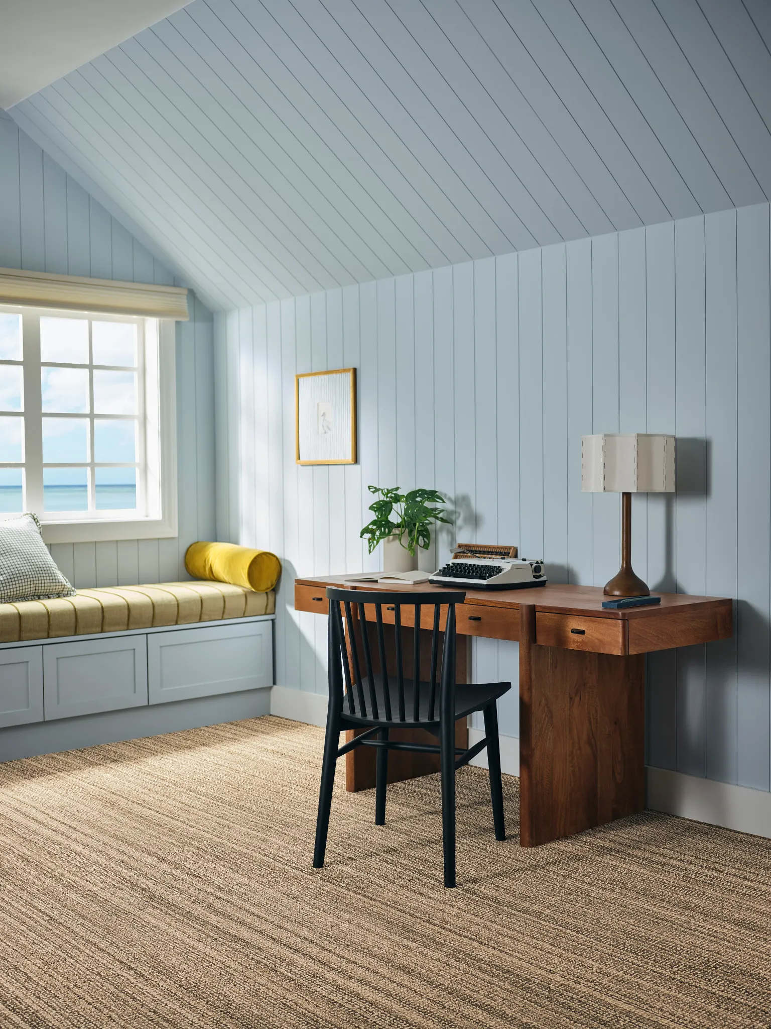 Gray patterned carpet with a textured design next to a green metal chair on a tiled floor