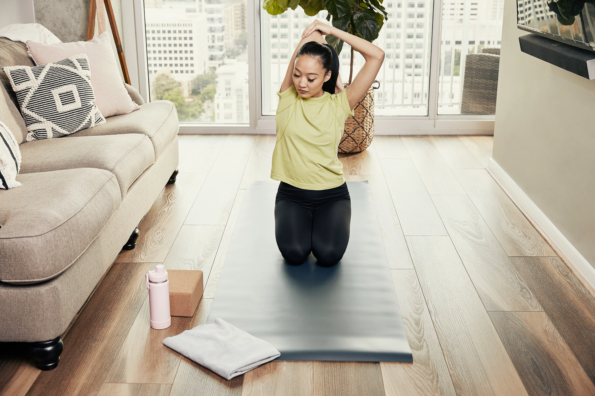 Woman doing yoga on the floor