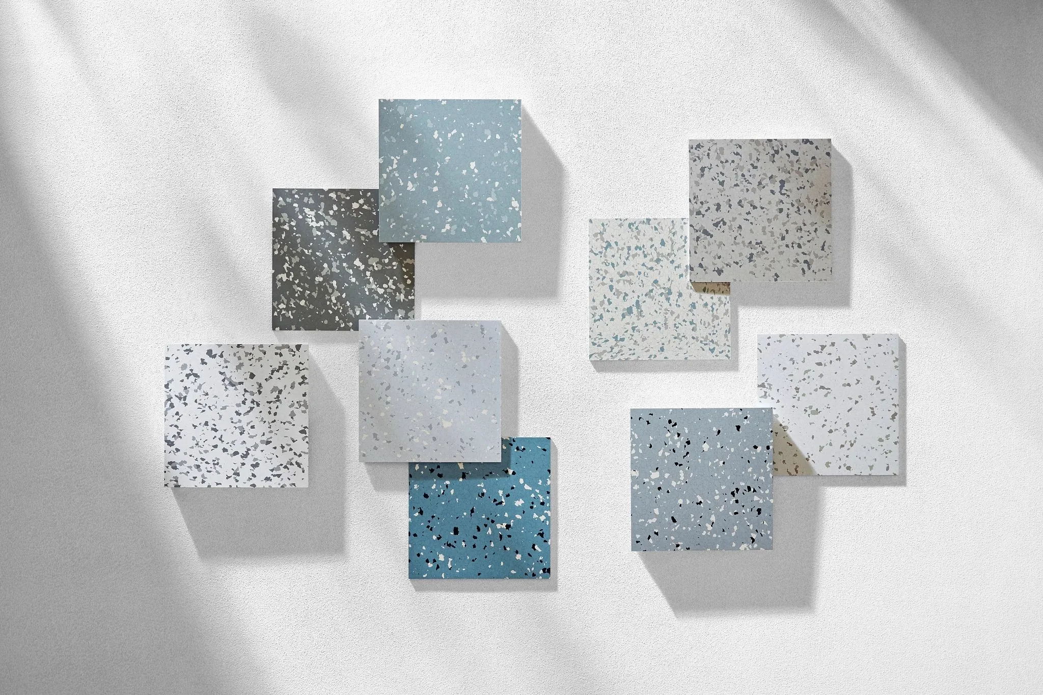 Vinyl flooring swatches in red, teal, navy, green, purple, and blue