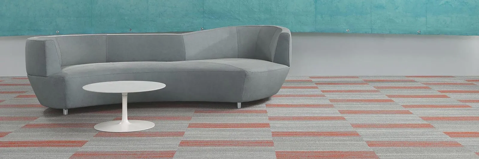 Modern living room with gray and orange carpet tiles