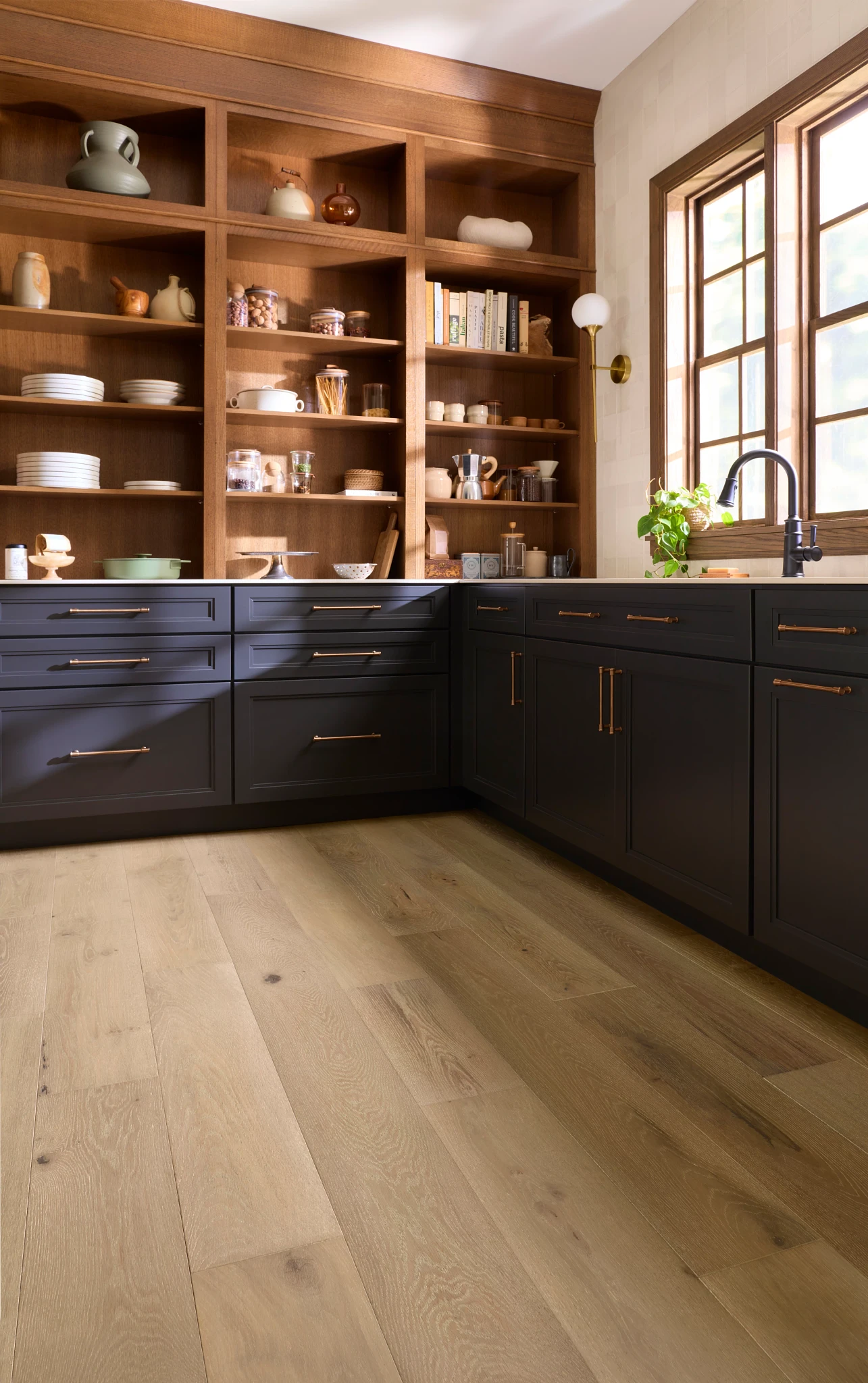 Elegant hardwood flooring in a kitchen with wide planks and natural wood tones