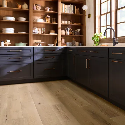 Premium Wide Plank Hardwood Flooring in Natural Wood Tones Elegant hardwood flooring in a kitchen with wide planks and natural wood tones