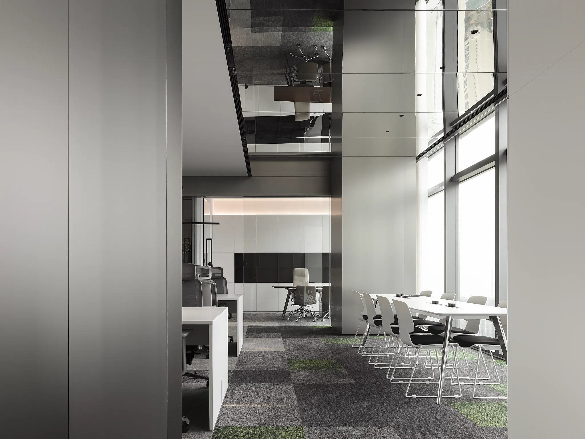 Modern office space with commercial carpet tile flooring in shades of gray and green, featuring sleek white chairs and tables