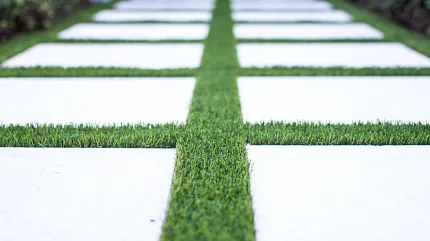 Stylish artificial grass and concrete tile pathway design Modern outdoor walkway with artificial grass and concrete tiles