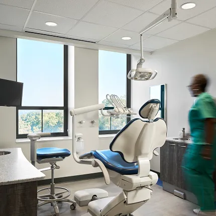Healthcare Facility with Commercial Flooring and Dental Equipment Modern dental office with sleek dental chair and commercial flooring