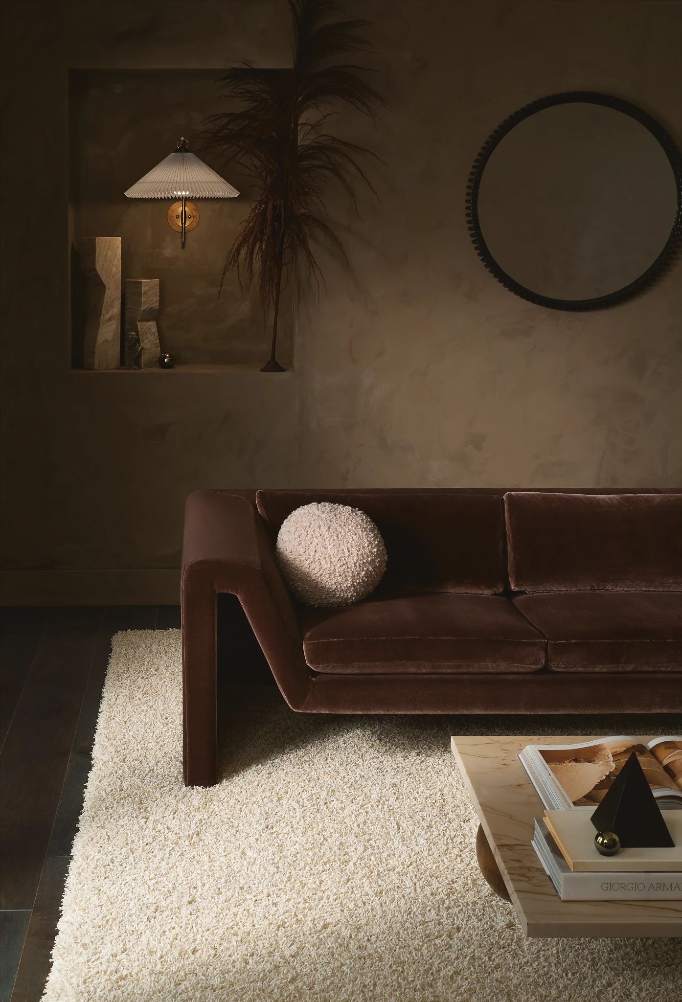 Luxurious cream-colored carpet flooring in a stylish living room with a brown velvet sofa and modern decor