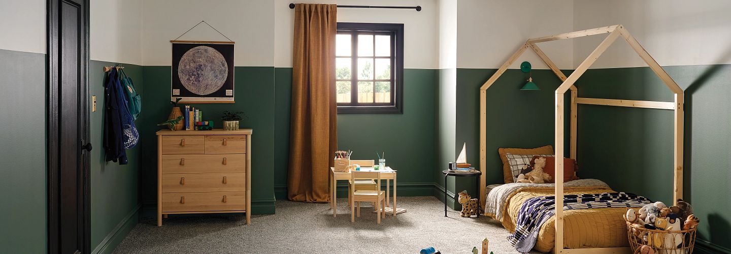 cozy kids bedroom with tonal beige carpet and transitional bedding