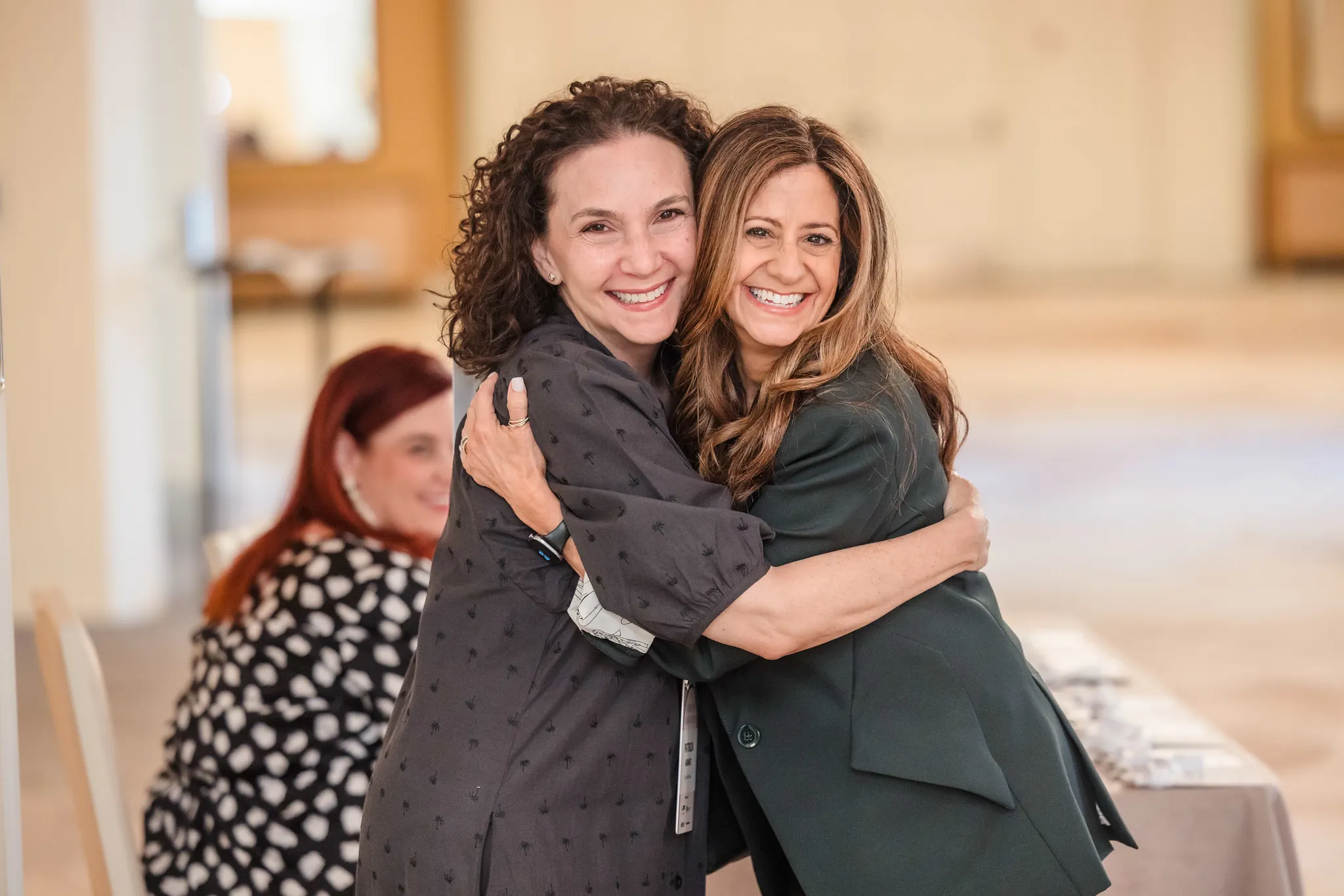 Two Leaders In Design Hosting A Meeting