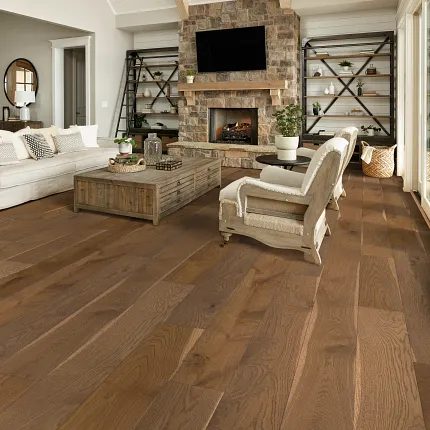 Warm Brown Engineered Hardwood Flooring in Cozy Living Room Cozy living room with stone fireplace and engineered hardwood flooring in warm brown tones
