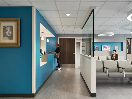 Modern Healthcare Facility Waiting Area with Commercial Flooring Healthcare facility waiting area with modern seating and blue accent walls, featuring commercial flooring.