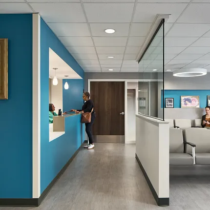 Modern Healthcare Facility Waiting Area with Commercial Flooring Healthcare facility waiting area with modern seating and blue accent walls, featuring commercial flooring.