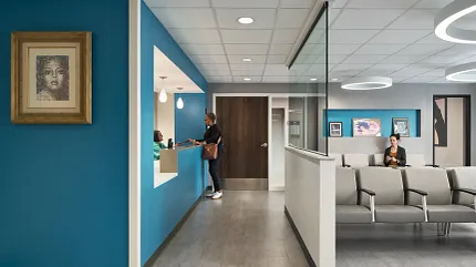 Modern Healthcare Facility Waiting Area with Commercial Flooring Healthcare facility waiting area with modern seating and blue accent walls, featuring commercial flooring.
