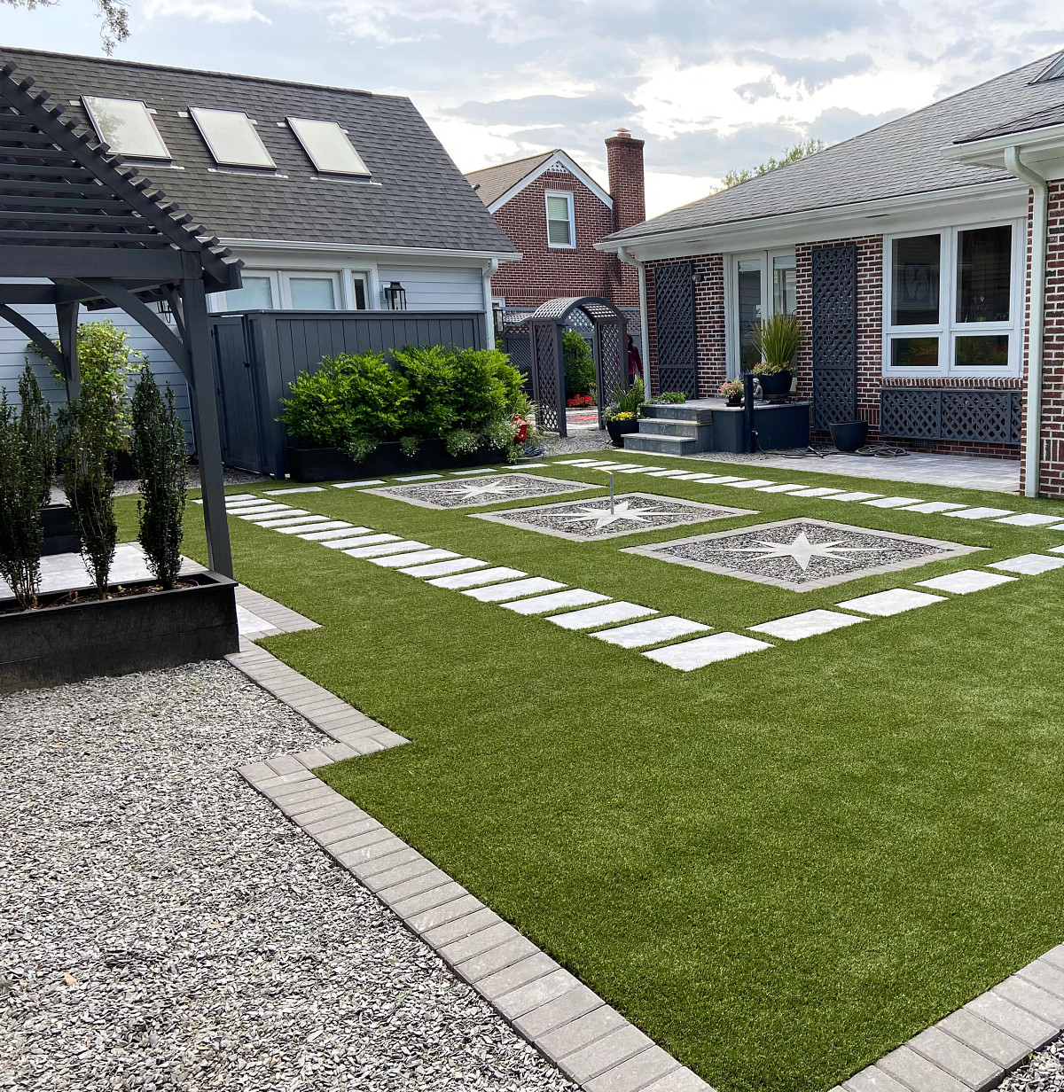 Backyard with Turf stylishly installed with tile walkway