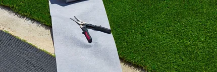 Easy artificial turf setup with essential tools Artificial grass installation with tools and underlay