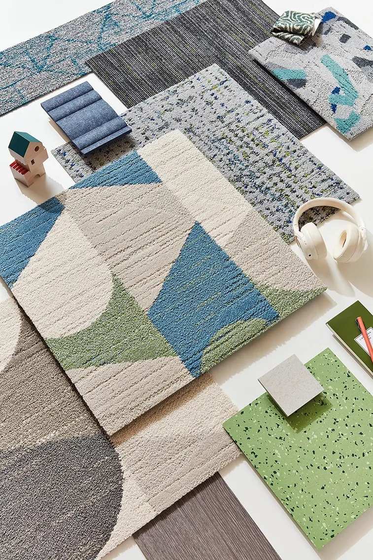 Assorted carpet swatches in blue, green, gray, and beige
