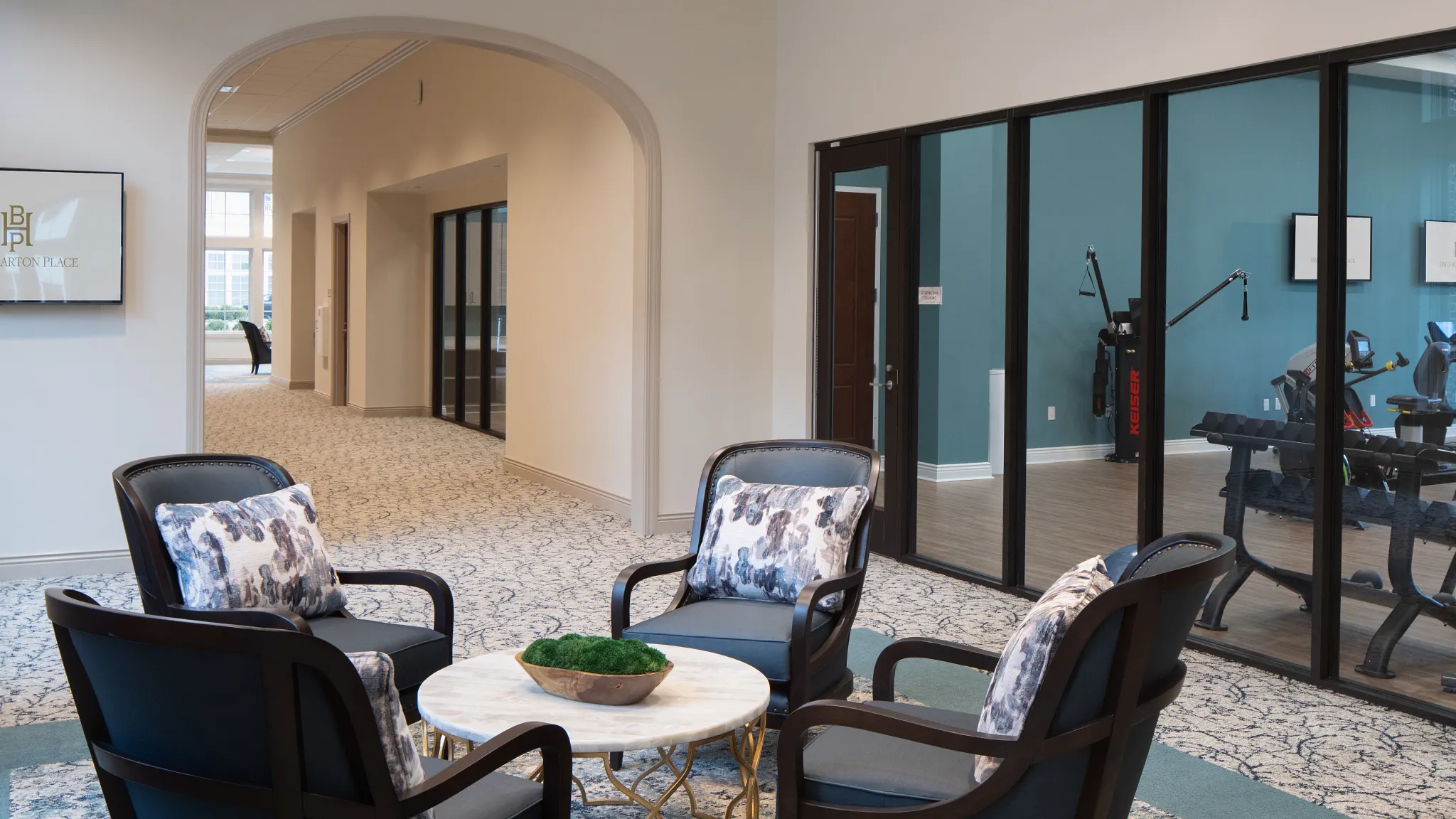 custom broadloom carpet shown in a senior living common area near a gym area