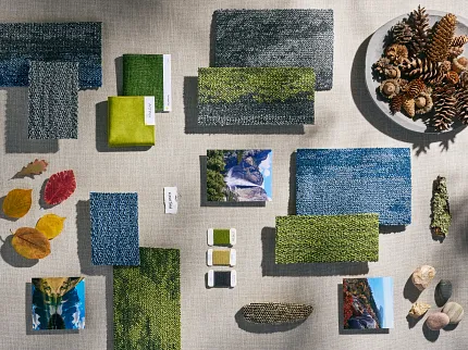 Green and Blue Commercial Carpet Tile Swatch Collection with Natural Elements Swatch collection featuring various shades of green and blue commercial carpet tiles with natural elements like pinecones and leaves