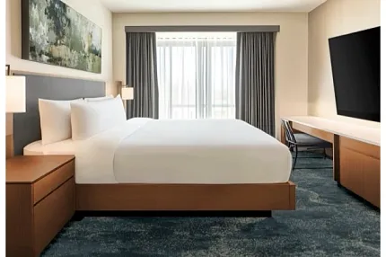 Elegant tufted carpet for hospitality interiors Hospitality room with tufted broadloom carpet in shades of blue and gray