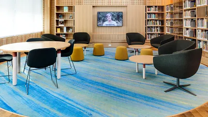 University of Tasmania Library Learning Space Featuring Custom Flooring Design | Shaw Contract Collaborative learning area at the University of Tasmania library featuring custom blue patterned flooring, lounge seating and flexible study spaces.