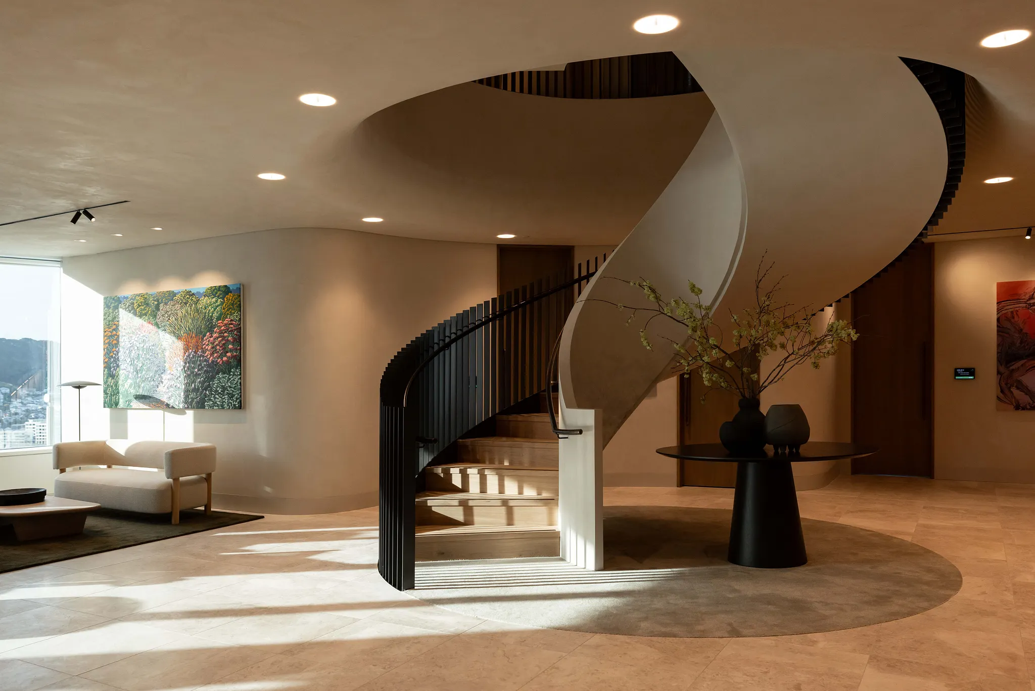 Modern spiral staircase in elegant living room with beige flooring