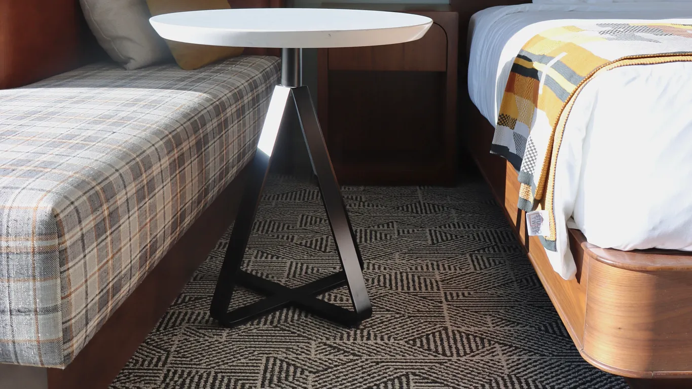 Hotel guestroom with bed and couch